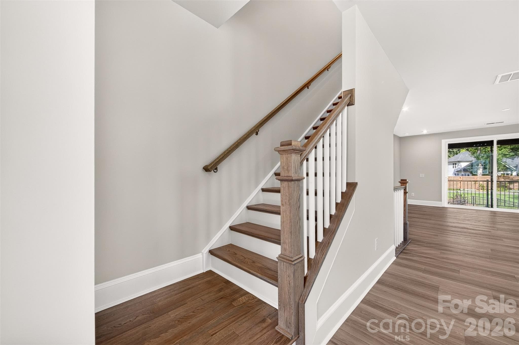 second floor with oak box stairs - 411 Old Town Village Road, Waxhaw