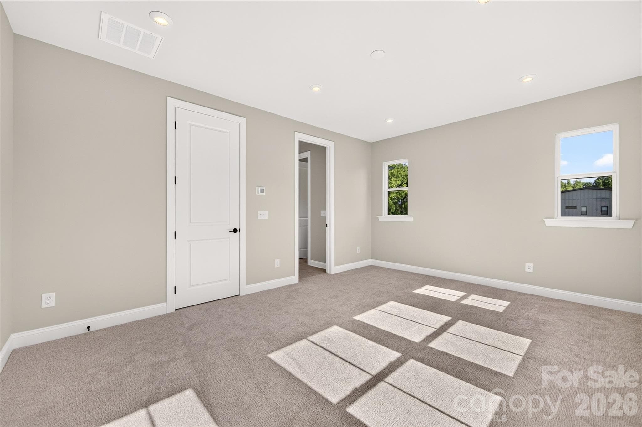 Light filled primary bedroom - 411 Old Town Village Road, Waxhaw