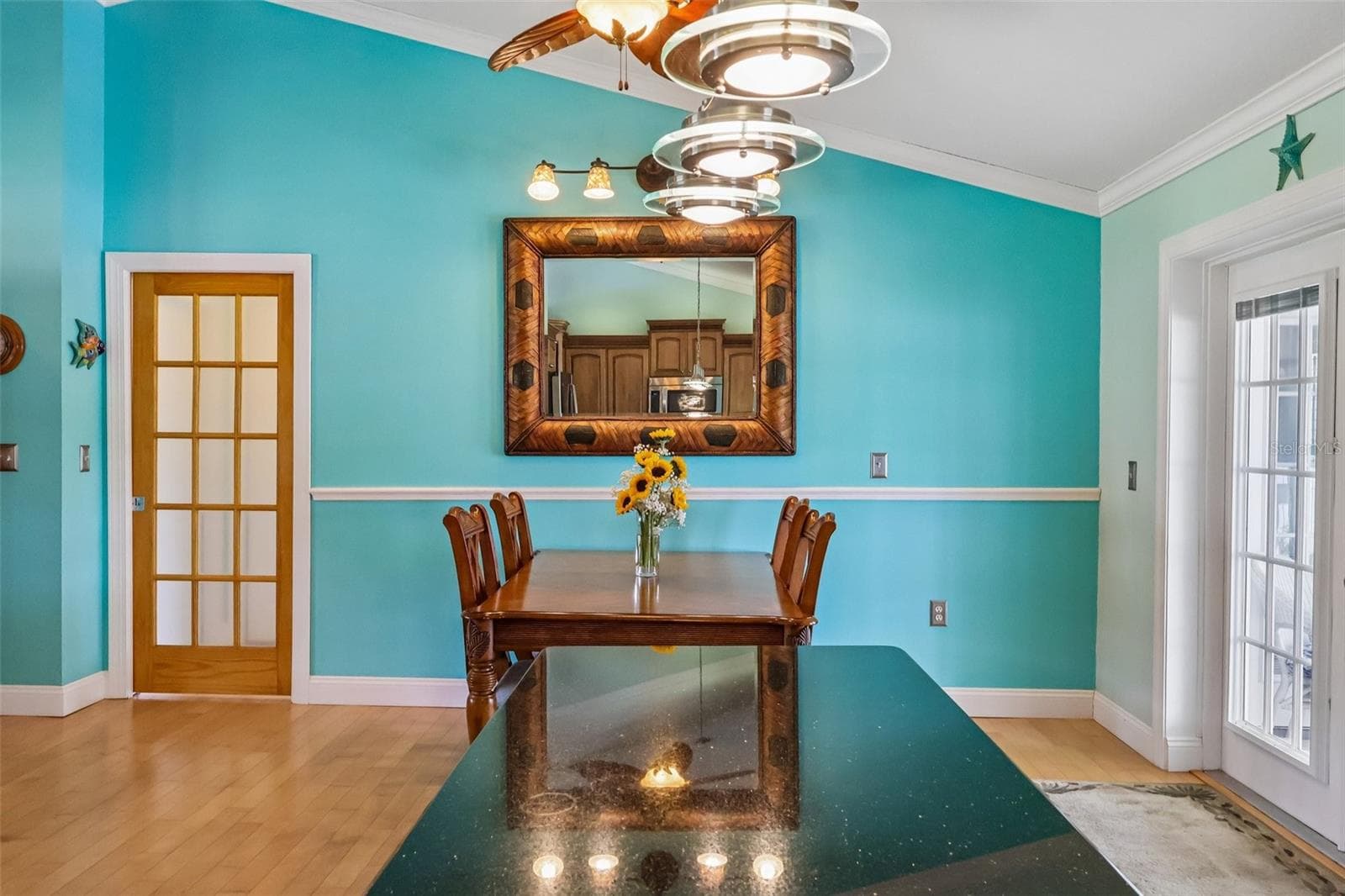 Dining area with pocket door to Master Suite and garage - 28116 LOIS DR, TAVARES