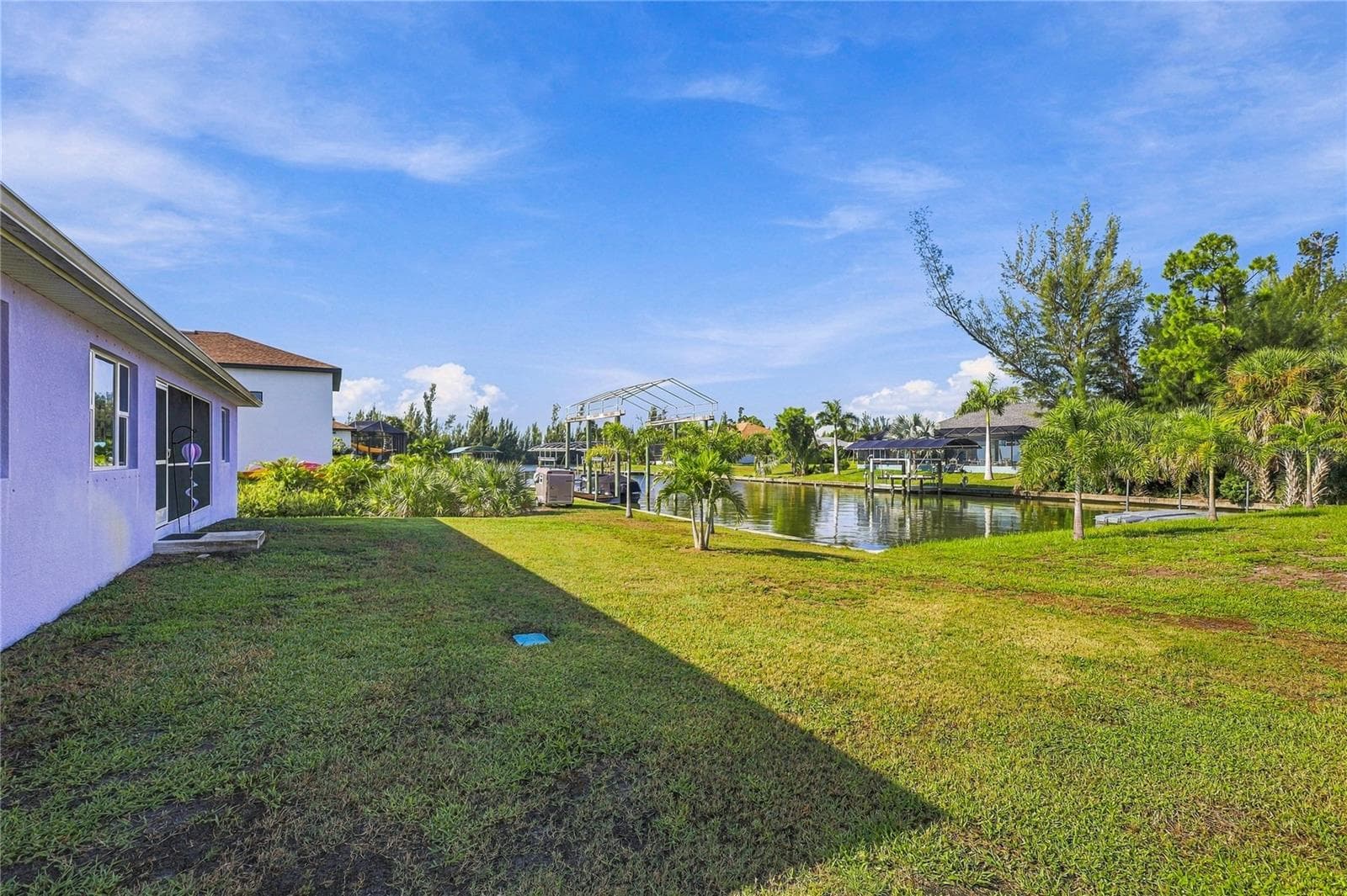 REAR VIEW WITH CANAL VIEW - 10554 LIVE OAK RD, PORT CHARLOTTE
