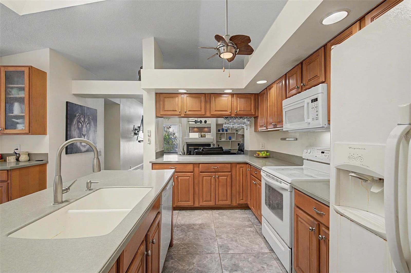 Kitchen with 2 skylights and eating area with 2 slider doors to the pool area. - 8612 BRAXTON DR, HUDSON