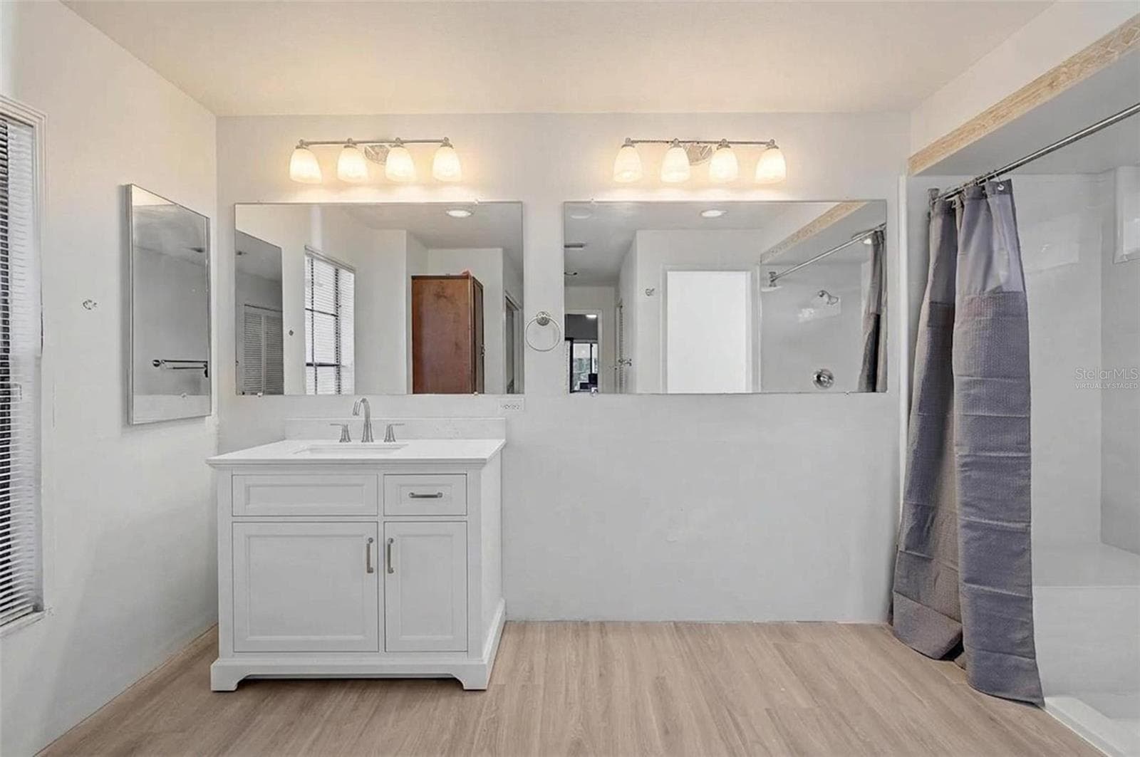 * Vanity if virtually staged. True vanity will be installed at end of Sept. Primary bathroom - 8612 BRAXTON DR, HUDSON