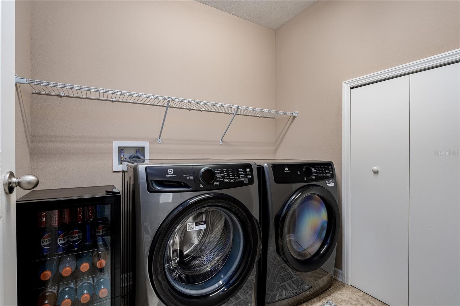 Laundry room with extra storage space under the stairs - 5918 OAK MILL TER, PALMETTO
