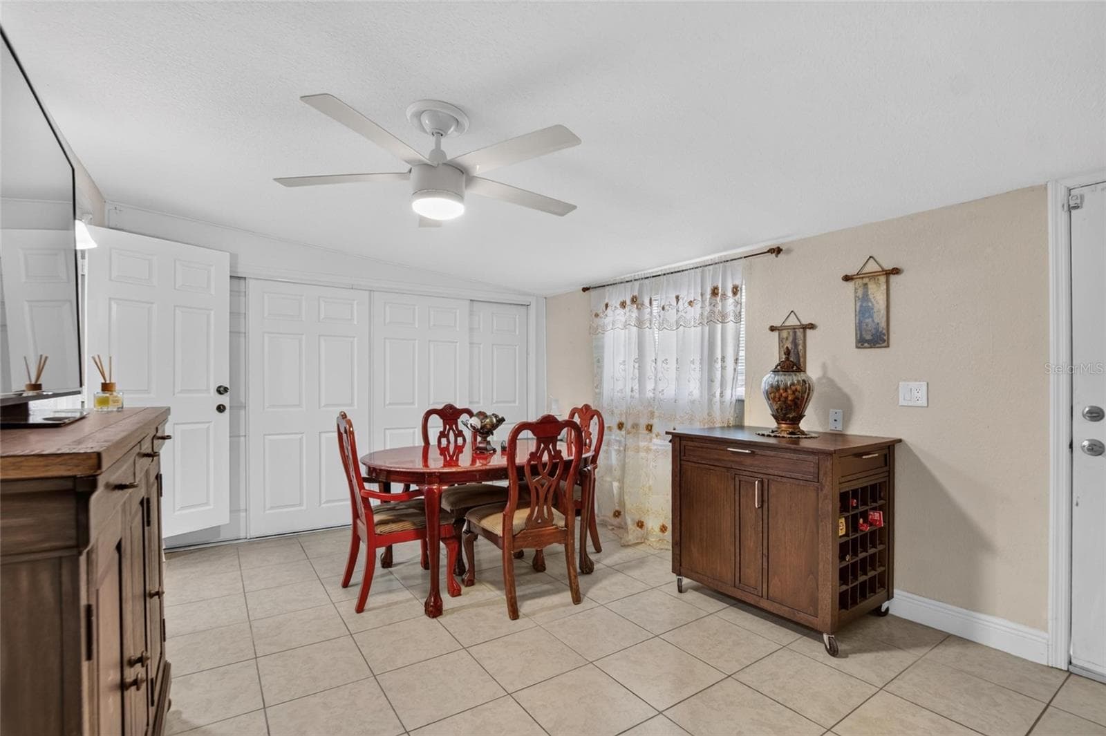 Bedroom 3, currently in use as a Dining Room. This room also has private access from outside (door off to the right) - 1727 WAIKIKI WAY, TAMPA