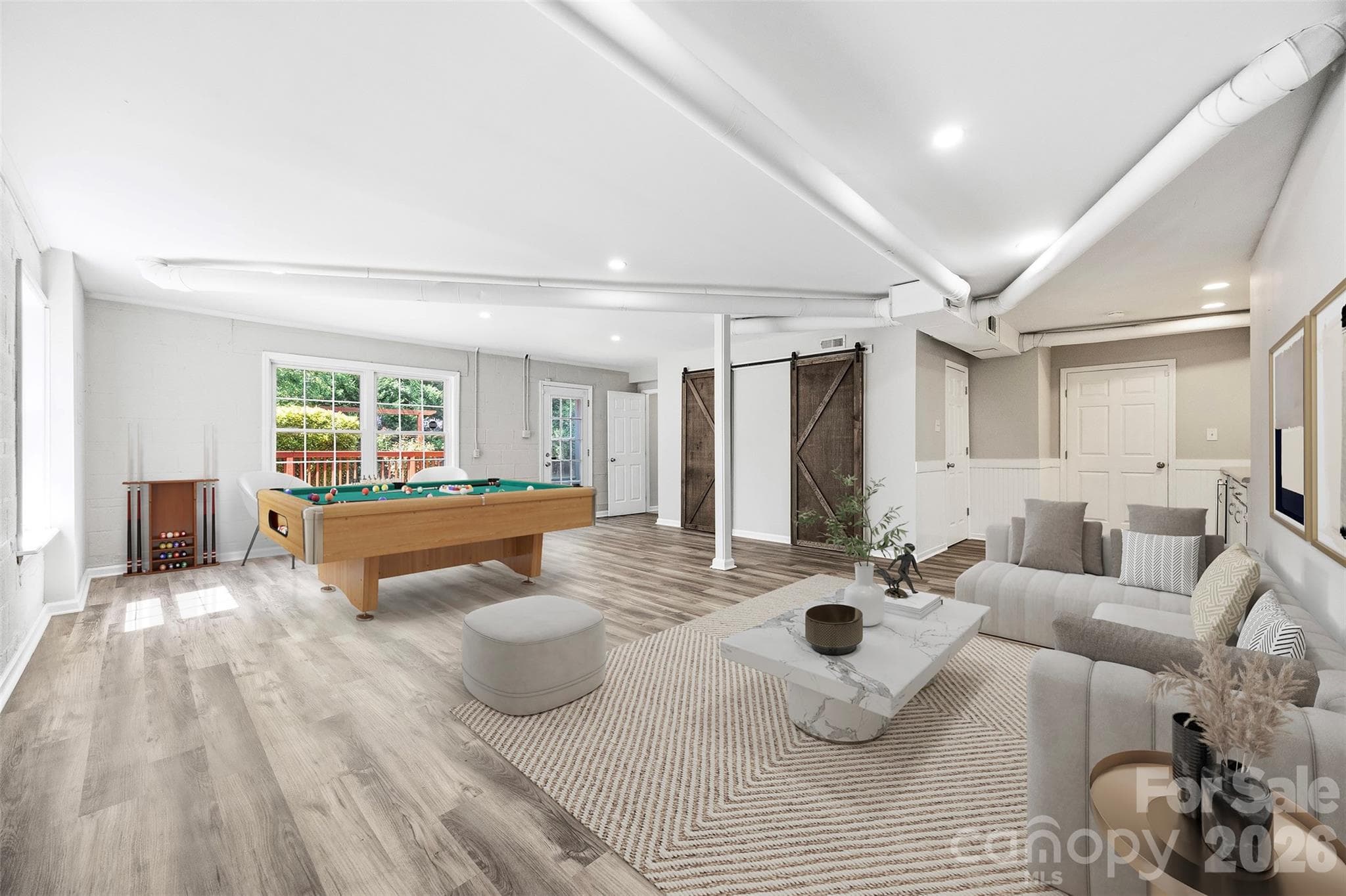 Basement level virtual image showing you how the space fills out and an idea for a fun way to use it. - 6506 Candlewood Drive, Charlotte