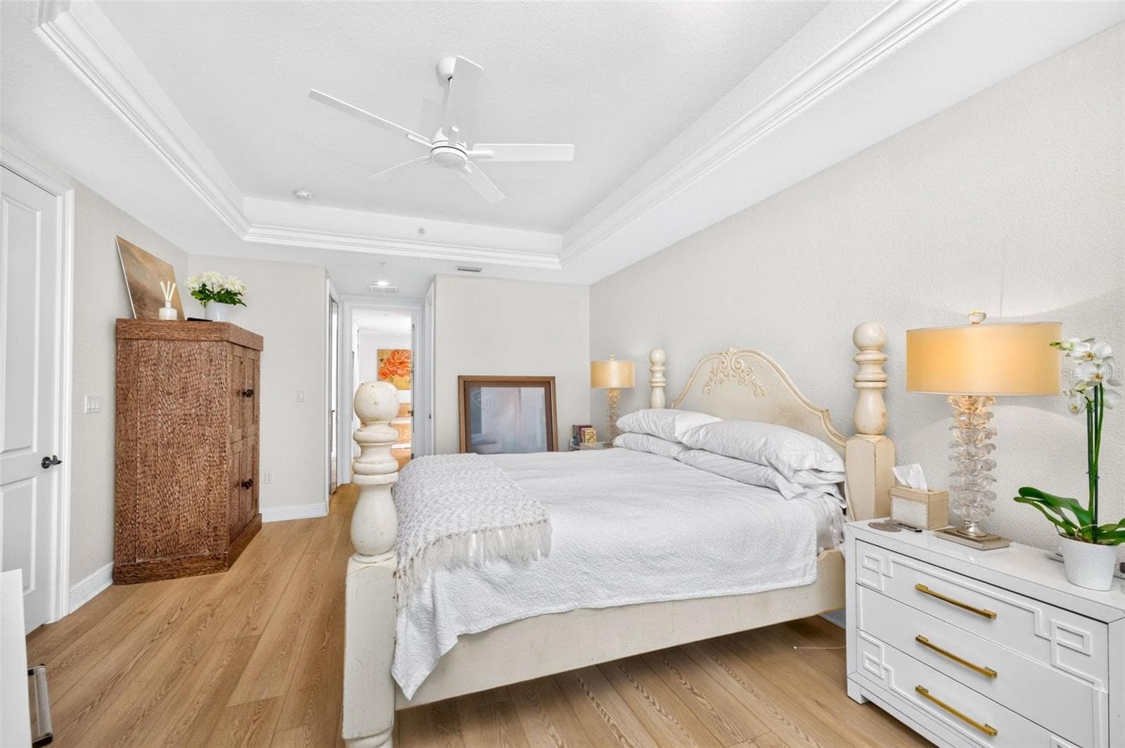 Master Bedroom ensuite feature single tray ceilings with crown inlay, an understanded elegant design - 95 N MARION CT #135, PUNTA GORDA