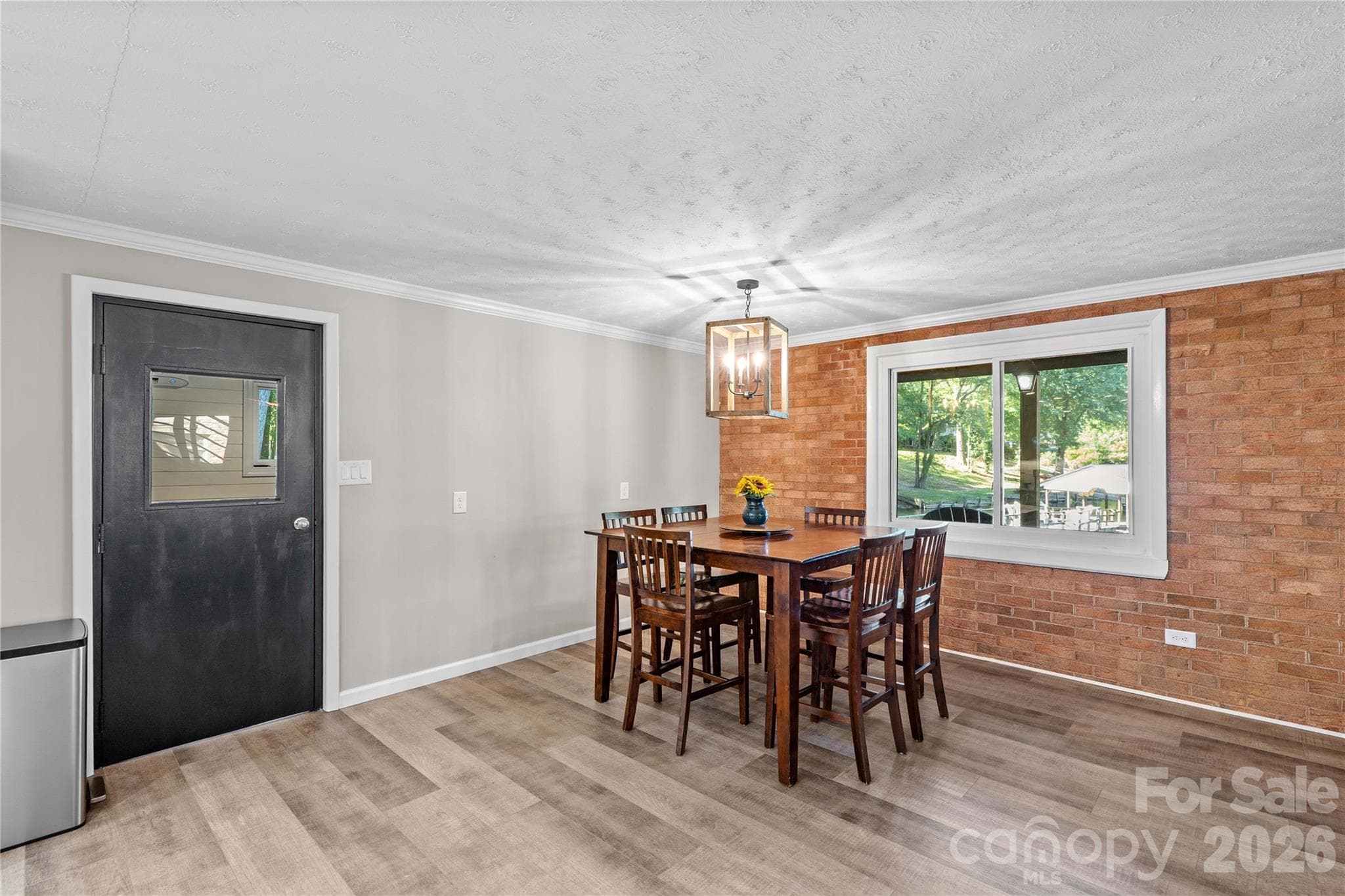 Dining area with lake view - 150 Shady Cove Drive, Troutman