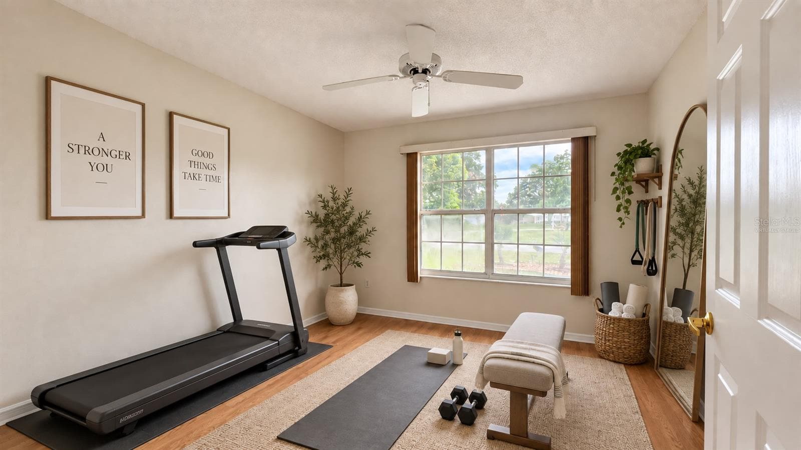 2 of 3 total bedrooms. Virtually staged as a home gym here. - 6501 SW 84TH PLACE RD, OCALA