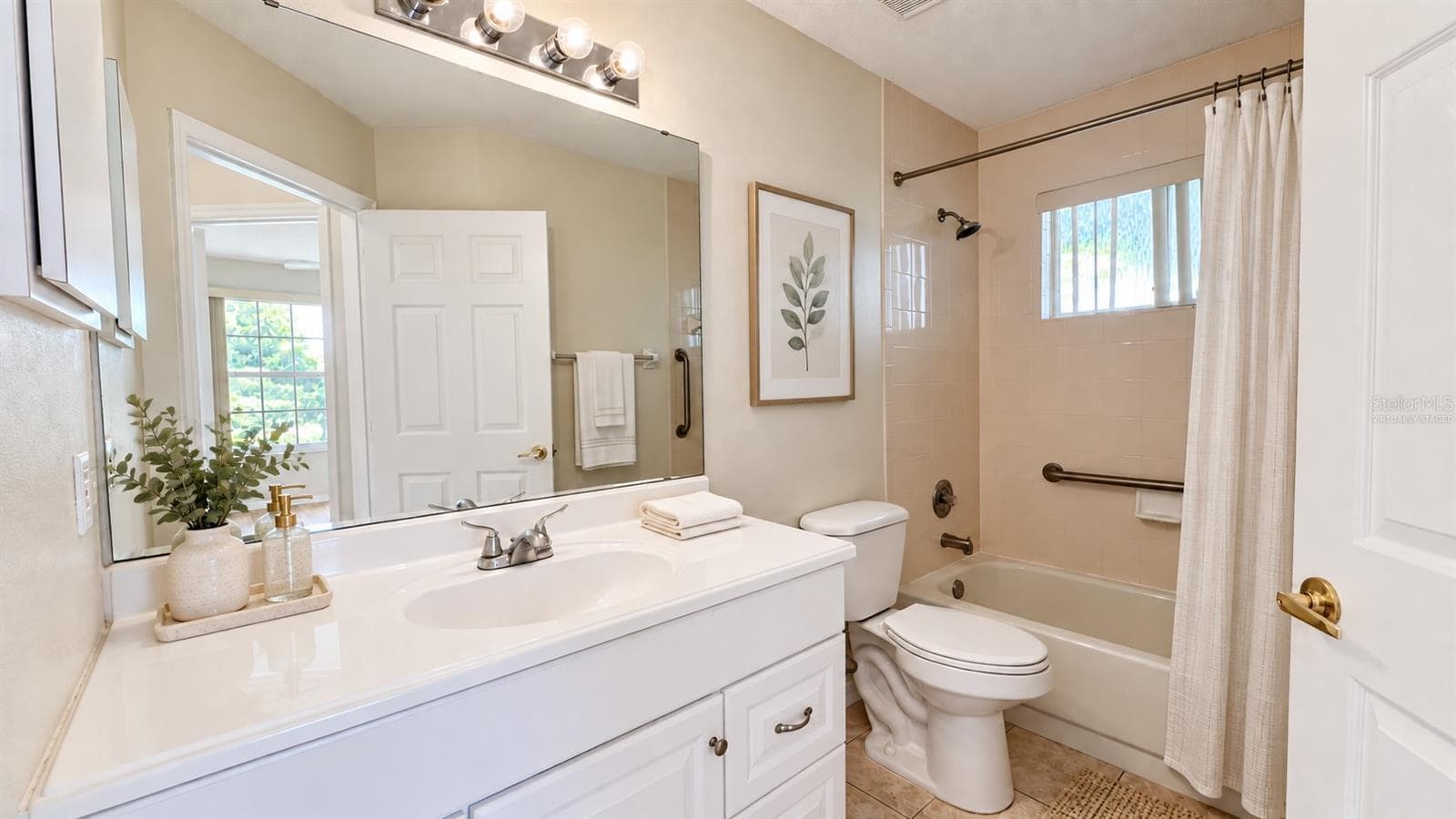 Guest bathroom is spacious. Virtually staged. - 6501 SW 84TH PLACE RD, OCALA