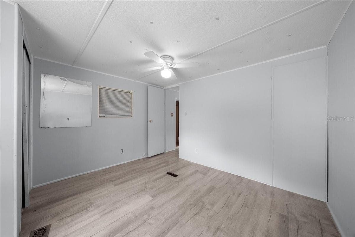 Primary Bedroom Built-in Closet - 1314 TEAKWOOD LN, LADY LAKE