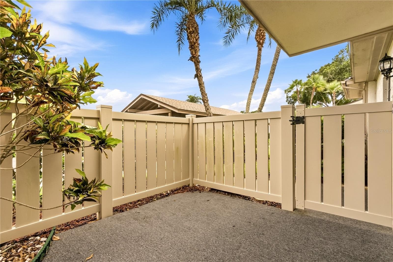 patio view looking at parking lot - 260 MICHAELS CIR, OLDSMAR