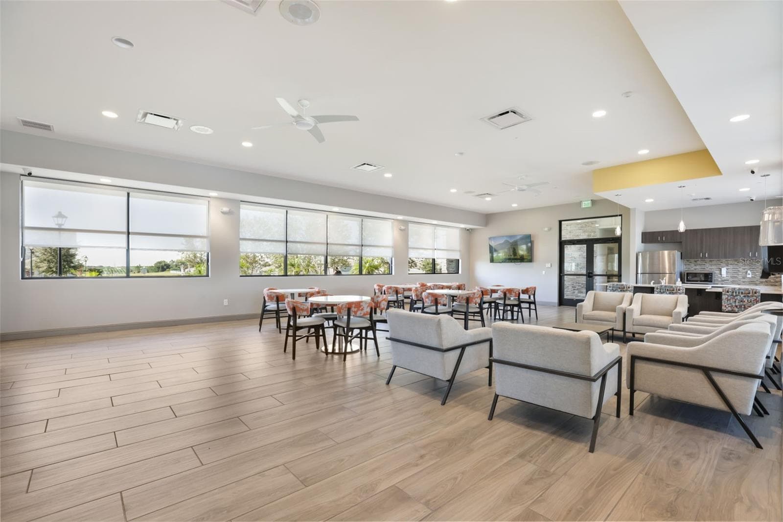 Another view of the Trinity Lakes clubhouse with lounge seating and space for community gatherings. - 7104 DILLY LAKE AVE, GROVELAND