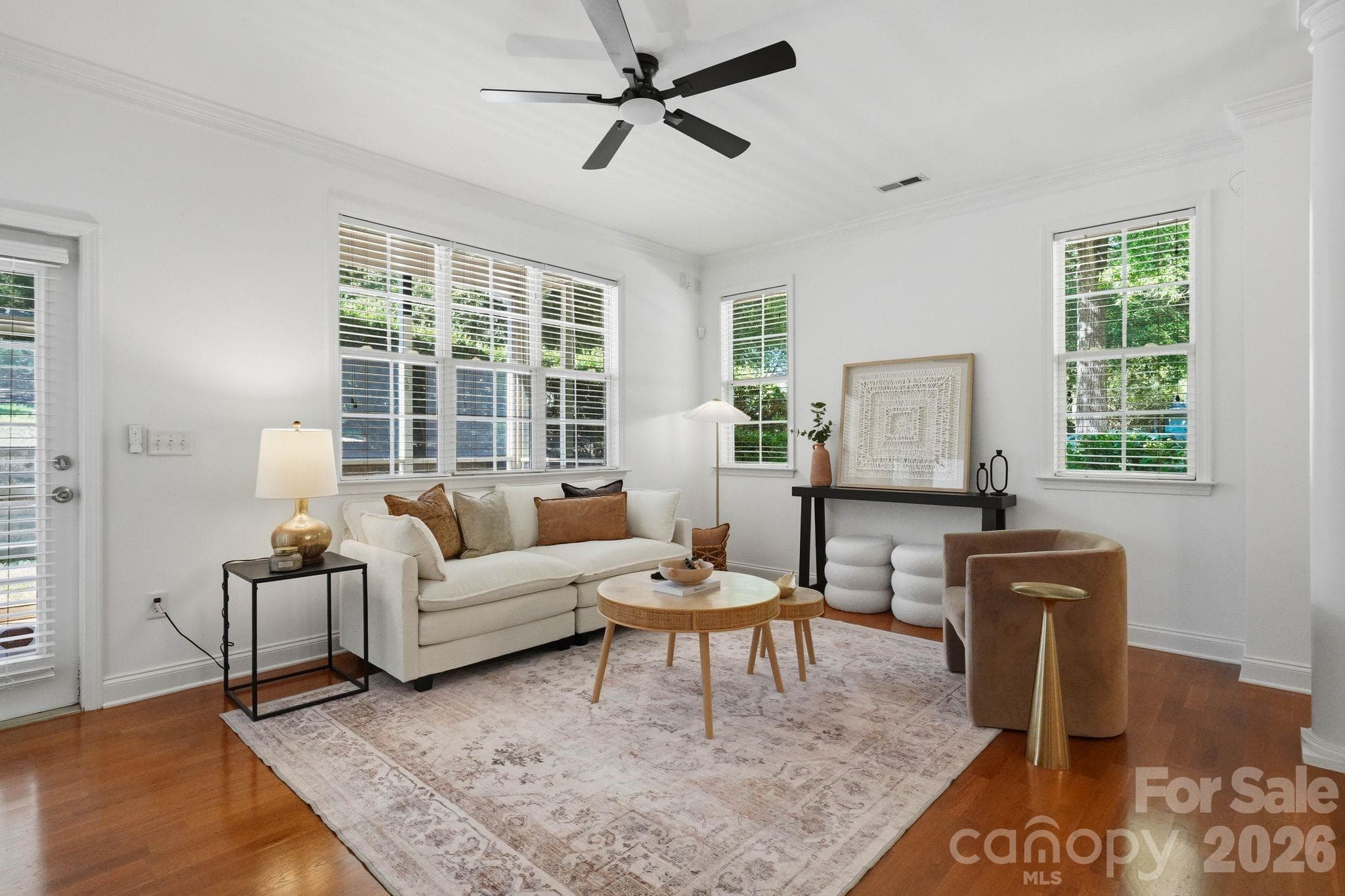 Bright main living space with multiple windows and an easy, open flow throughout the first floor. - 18810 Cloverstone Circle, Cornelius