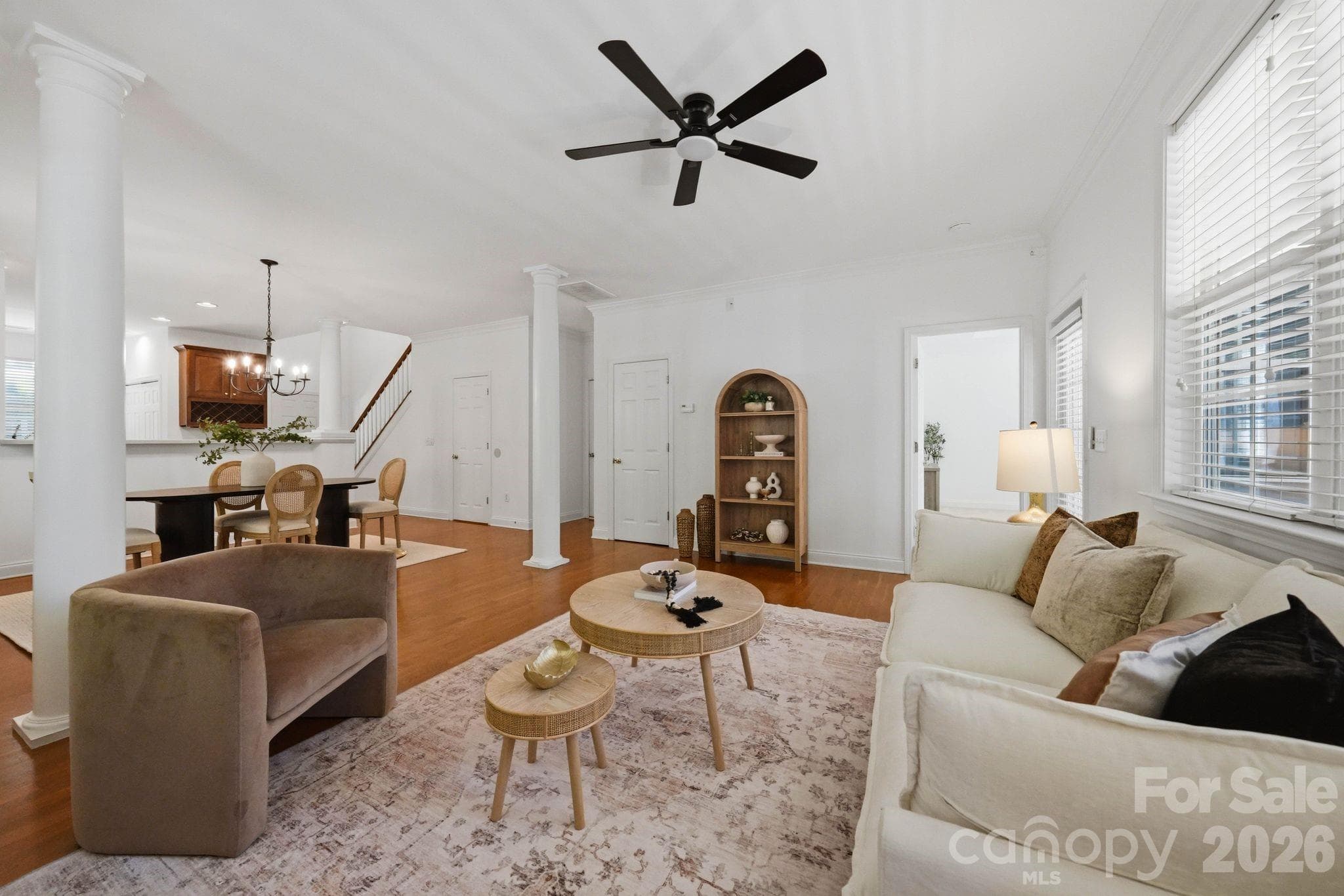 Comfortable family room with generous wall space, natural light, and direct access to the screened porch. - 18810 Cloverstone Circle, Cornelius