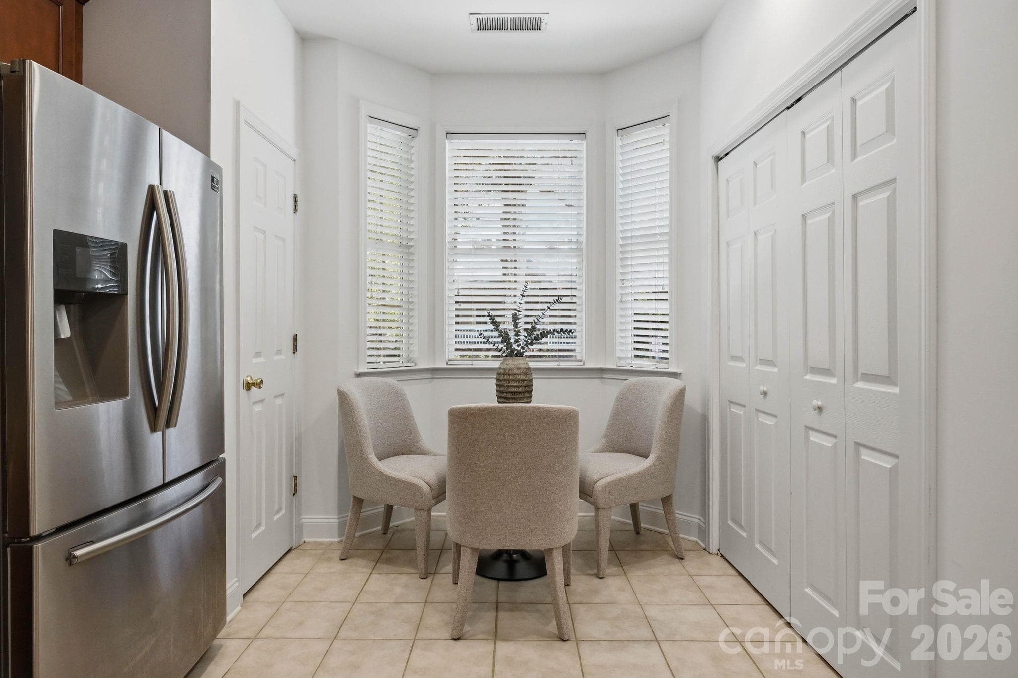 Light-filled kitchen positioned at the heart of the open main level. - 18810 Cloverstone Circle, Cornelius