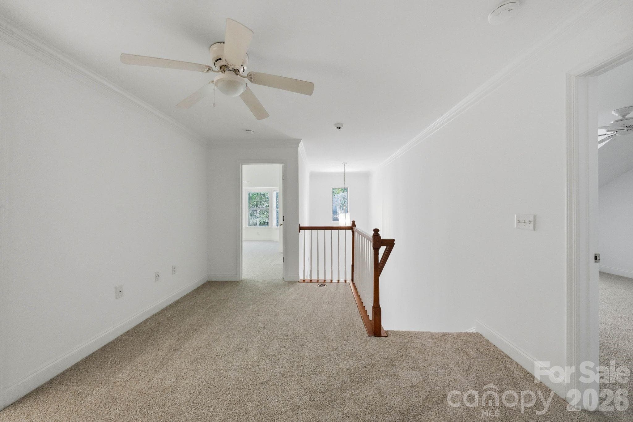 Flexible loft area at the top of the stairs provides additional living or workspace. - 18810 Cloverstone Circle, Cornelius