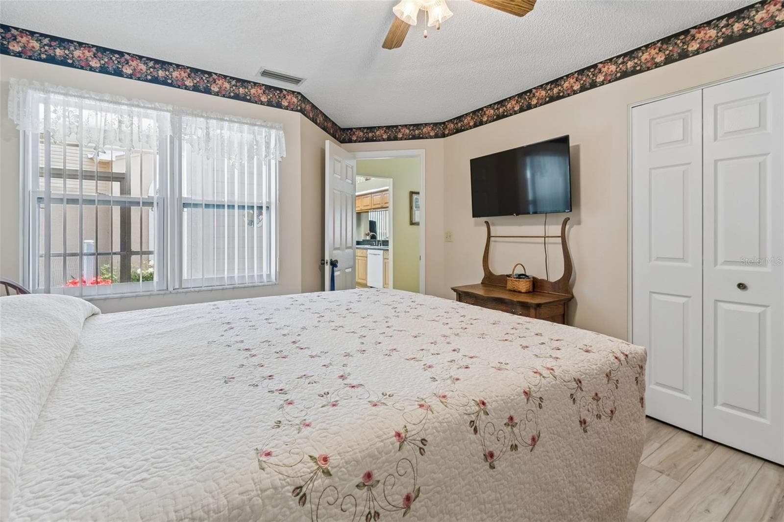 Guest bedroom with view of entryway - 5213 LOCHMEAD TER, ZEPHYRHILLS