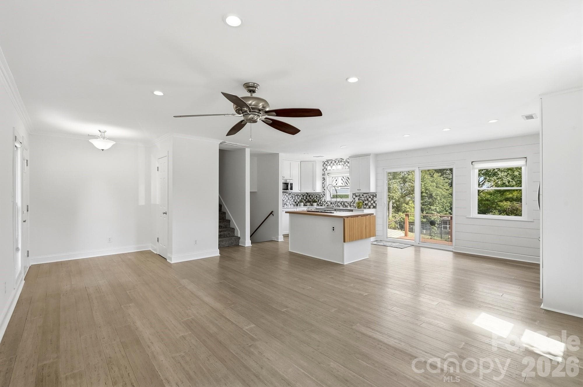 Beautiful LVP flooring throughout the main level adds a sophisticated, modern touch while offering the durability and easy maintenance today's buyers love. - 3022 Point Clear Drive, Tega Cay