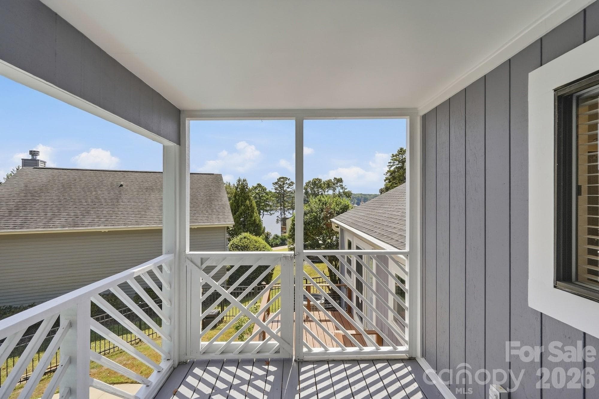 Beautiful Lake Wylie views can be enjoyed from many of the home's windows, bringing the serene beauty of the lake into your everyday living spaces. - 3022 Point Clear Drive, Tega Cay