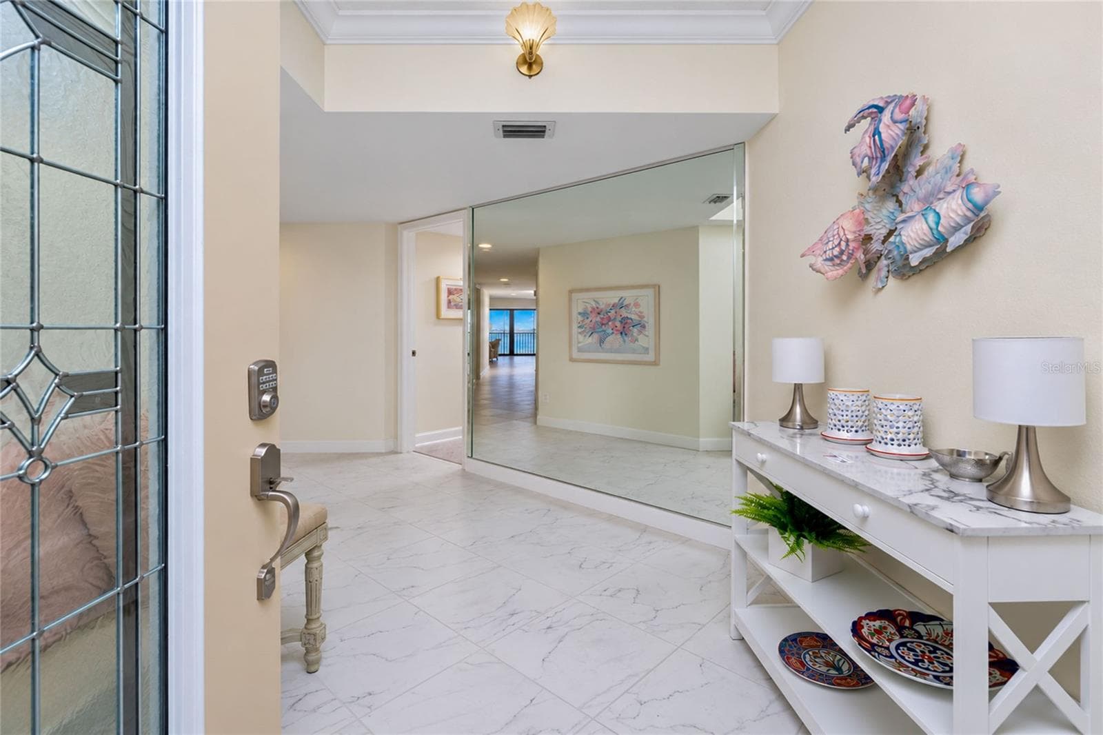 FOYER WITH LARGE TILE AND NICELY ACCENTED MIRRORED WALL - 1601 PARK BEACH CIR #136/18, PUNTA GORDA