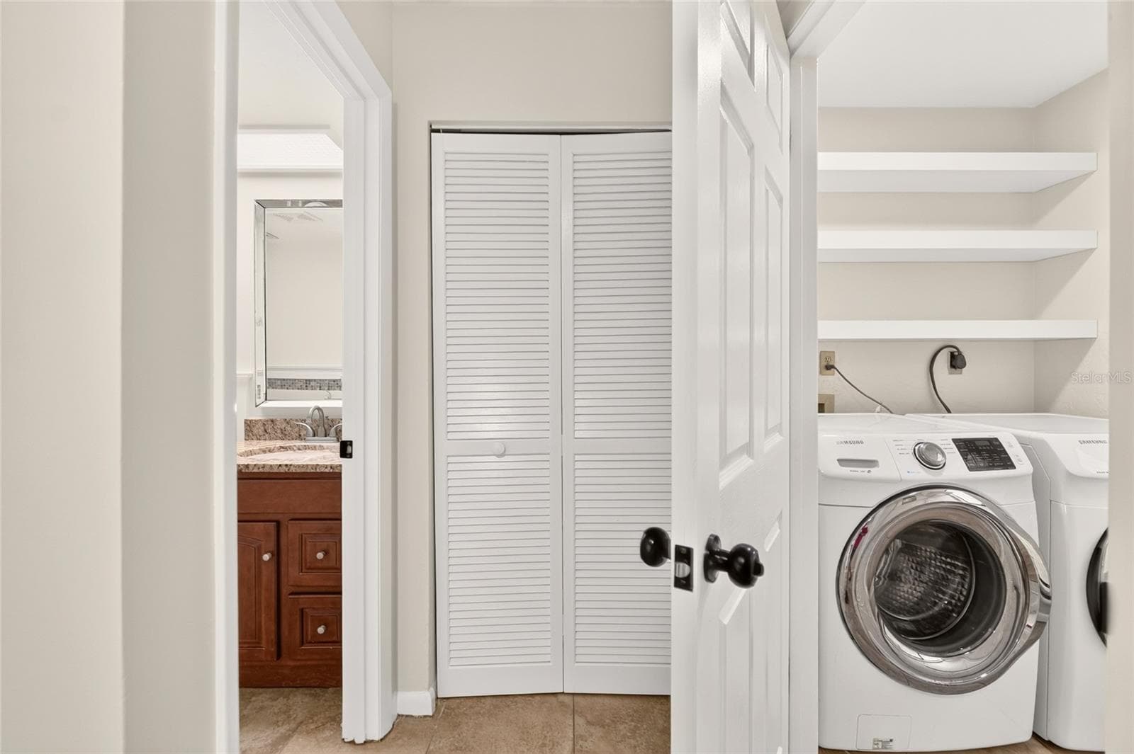 downstairs half bath/laundry - 4411 BLACK FOREST WAY, GAINESVILLE