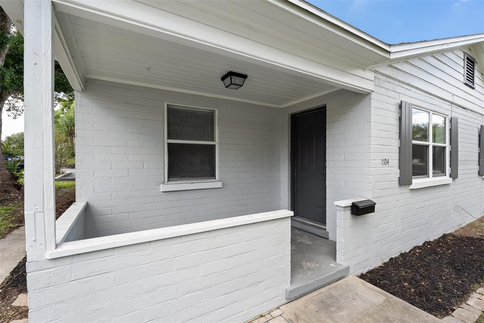Each unit has a front porch - 1104 E HARWOOD ST, ORLANDO