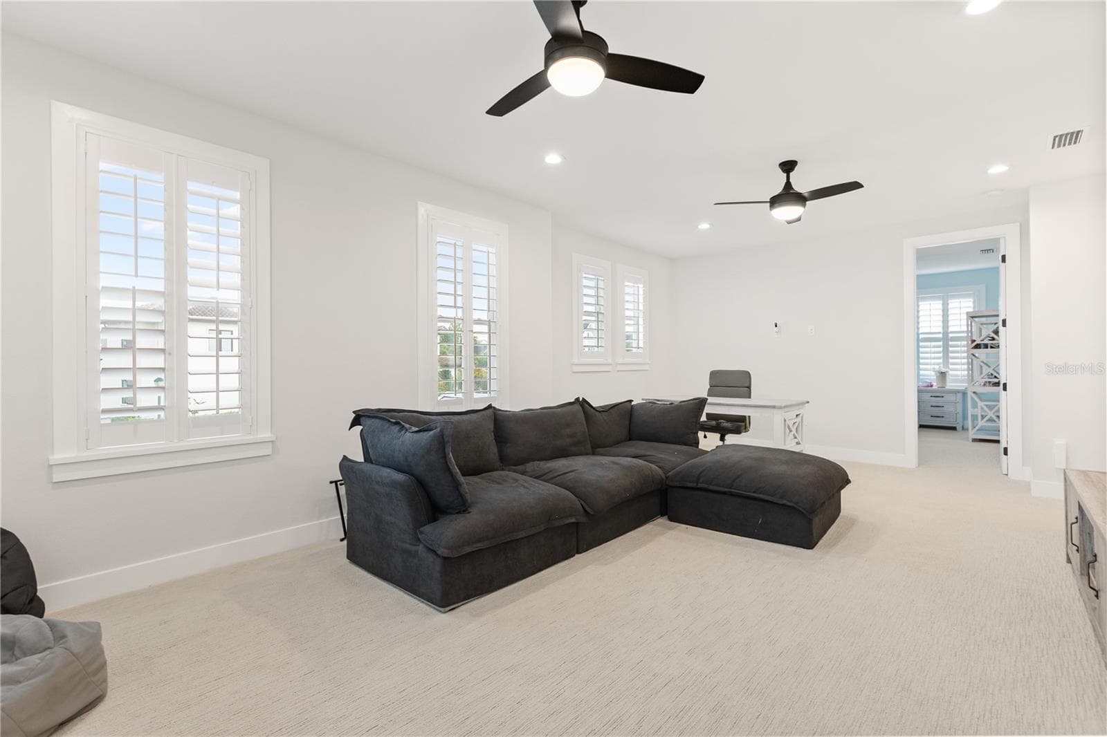 25' × 15' BONUS SPACEGenerous proportions give the upstairs loft room for a full media setup, oversized seating and additional study or recreation space. - 907 CELADON ST, WINTER GARDEN