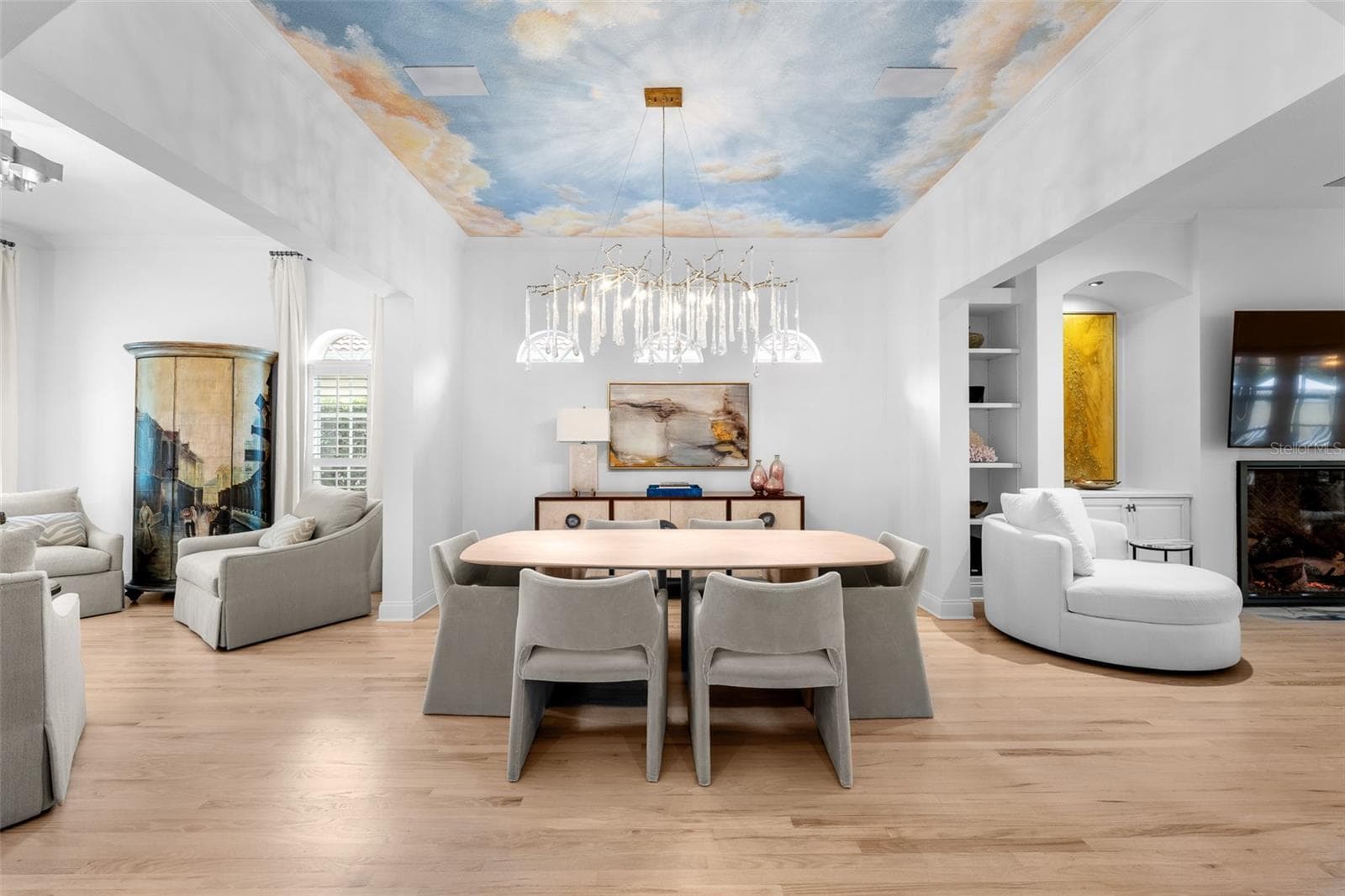 Sky ceiling mural, arched clerestory windows, and built-in cabinetry with open shelving. - 1921 FLORESTA VIEW DR, TAMPA