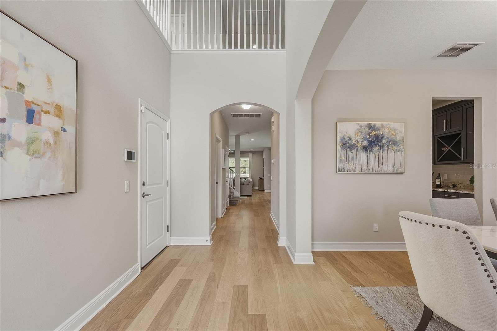 Two Story Foyer with Formal Dining room and Butler's Pantry leading to the Kitchen - 10702 PLEASANT KNOLL DR, TAMPA