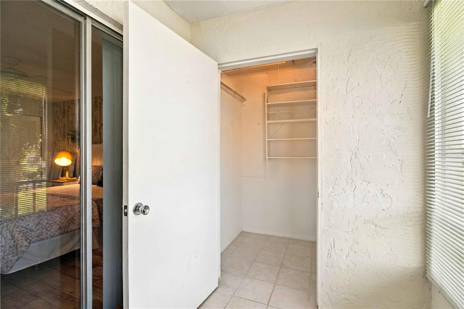 Storage closet on balcony (some totes items have been removed from the image, they will go with the seller) - 304 47TH AVENUE DR W #313, BRADENTON