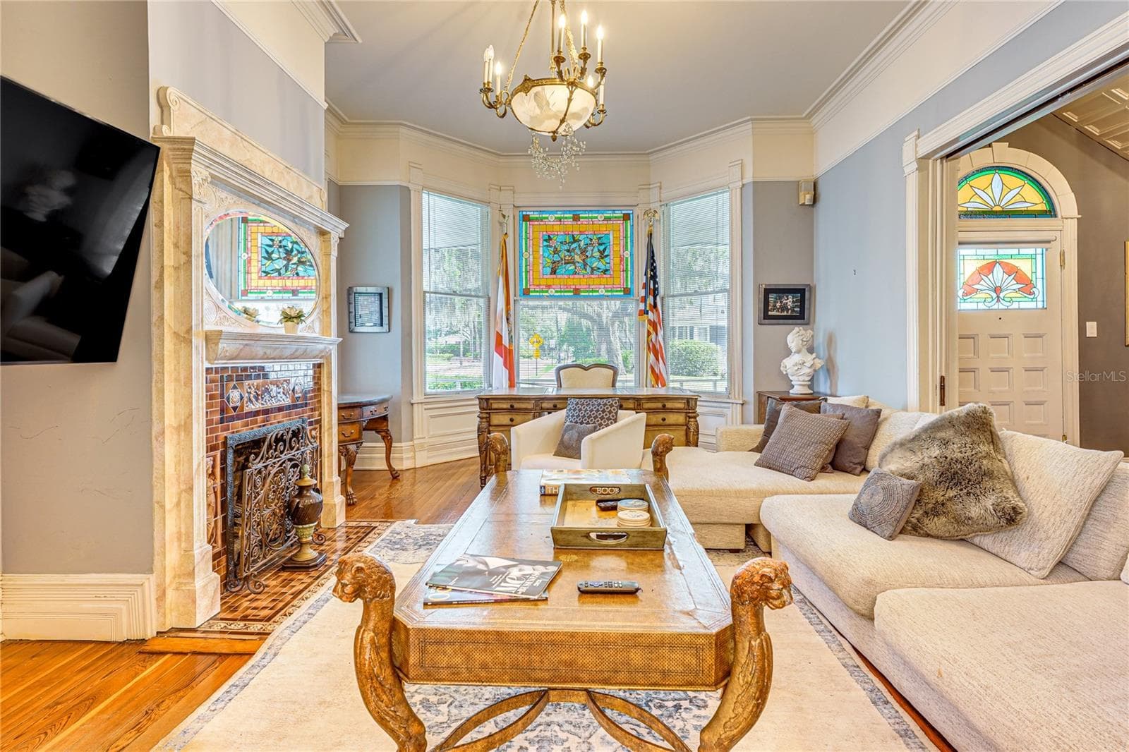 Living Room with Decorative Fireplace - 743 E FORT KING ST, OCALA