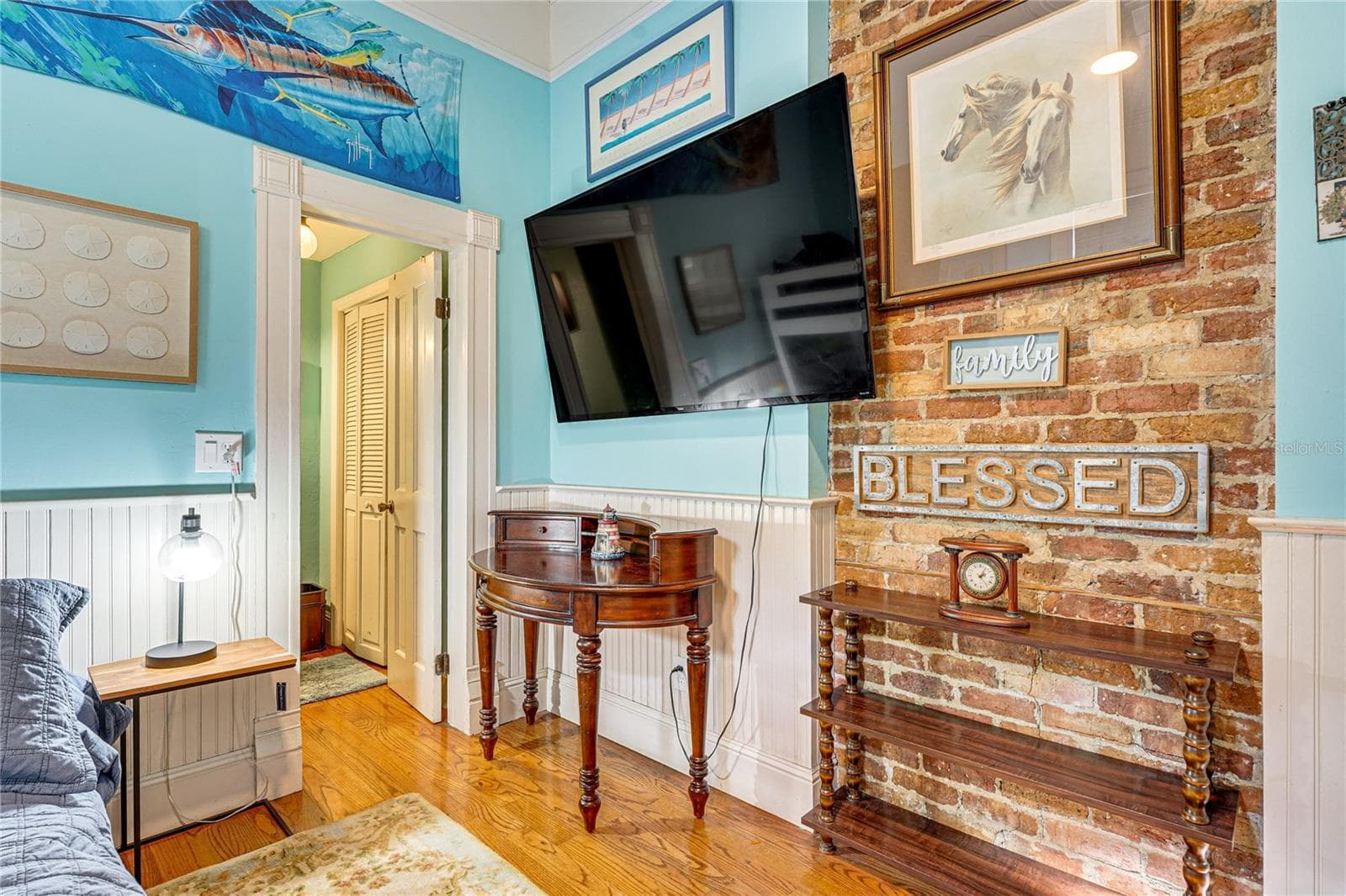 Bedroom with Exposed Brick Fireplace - 743 E FORT KING ST, OCALA