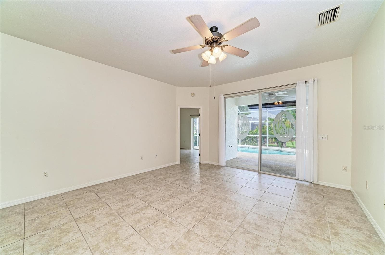 Living room with sliders to the pool/lanai - 1101 CANE MILL LN, BRADENTON