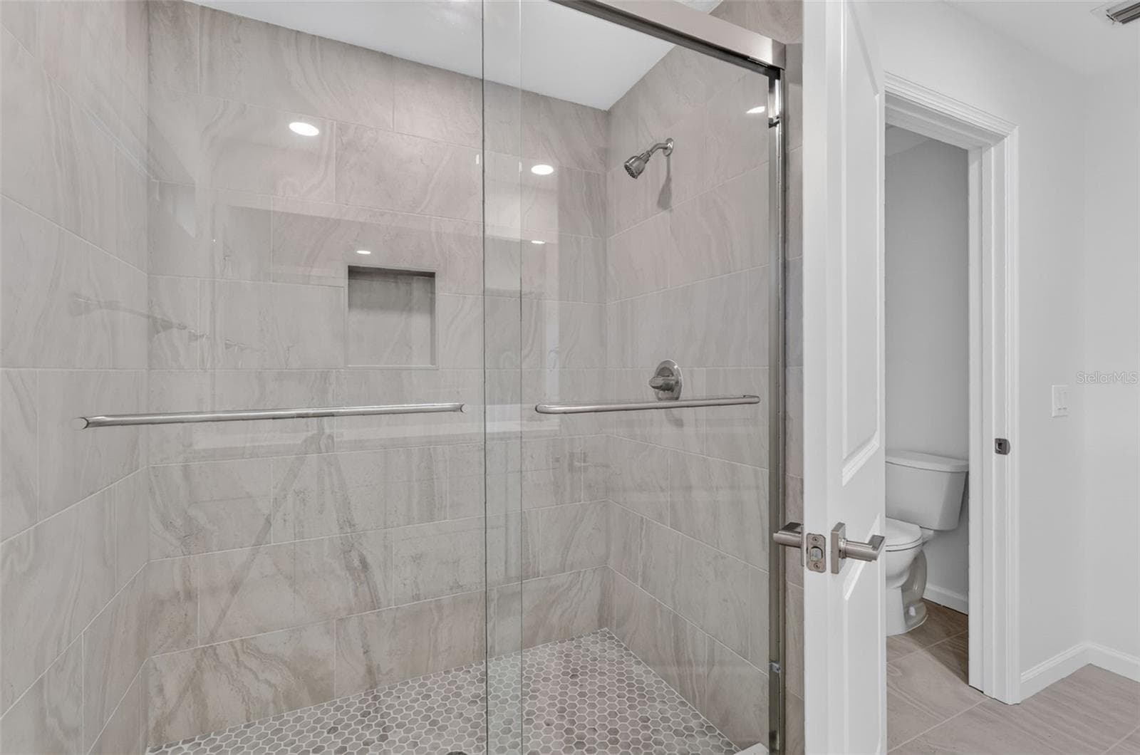 PRIMARY BATHROOM WITH WALK IN SHOWER AND PRIVATE TOILET AREA - 11041 SE 174TH LOOP, SUMMERFIELD
