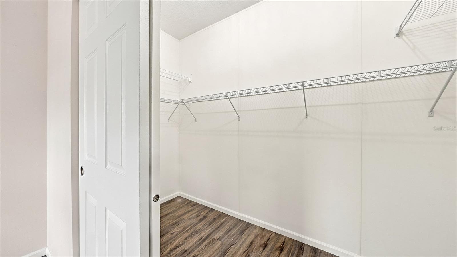 Primary large walk in closet - 10315 CORTEZ RD W #2F, BRADENTON