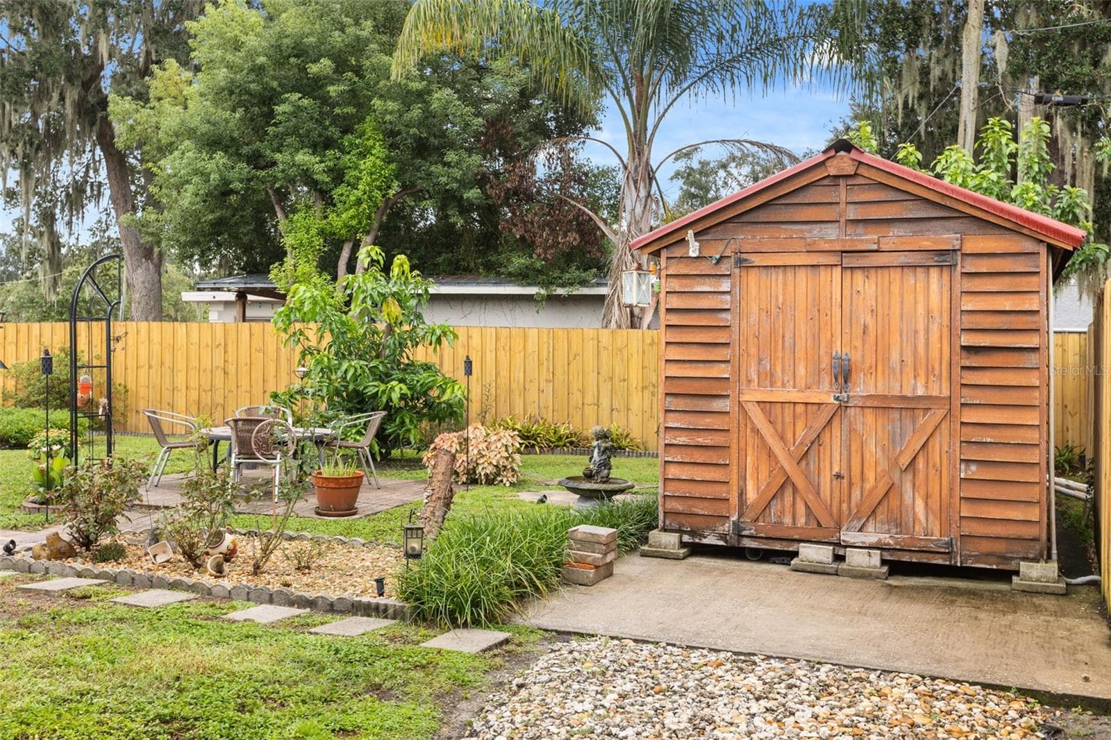 Fire pit, fruit tree, and shed. - 4511 LONGWORTH DR, ORLANDO