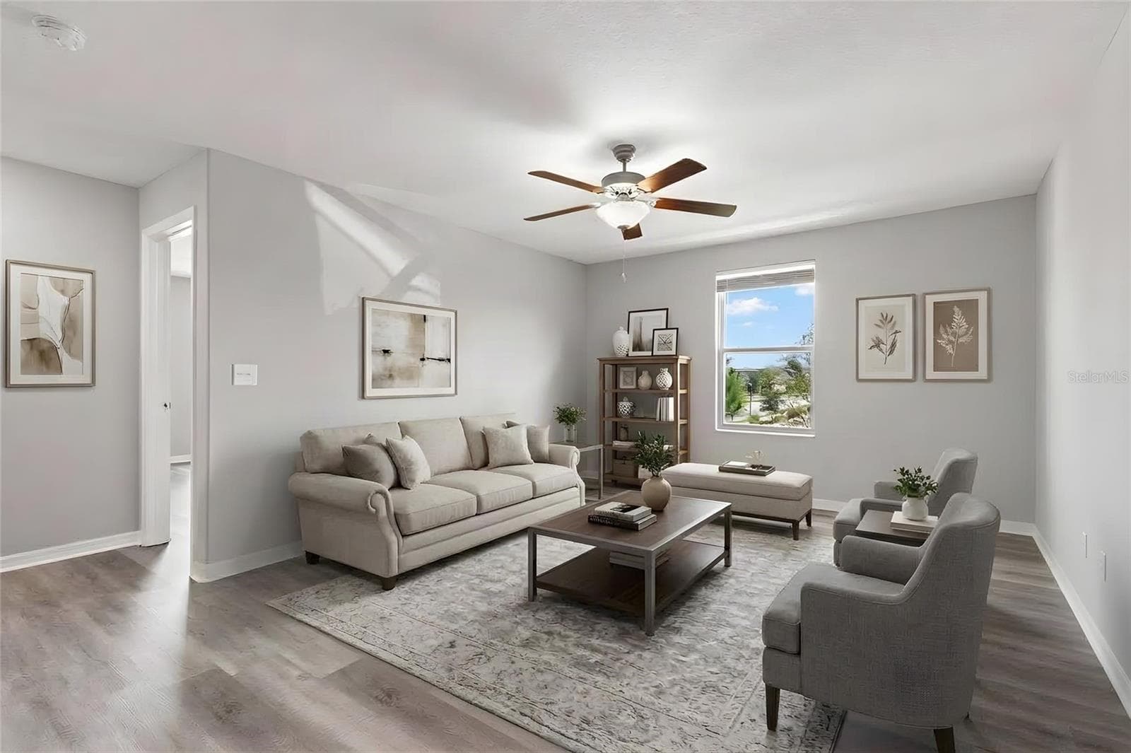 The upstairs loft offers generous open space for a media room, play area or second living room, with newly replaced laminate flooring, fresh neutral paint and a ceiling fan. - 5061 WHITE CHICORY DR, APOLLO BEACH