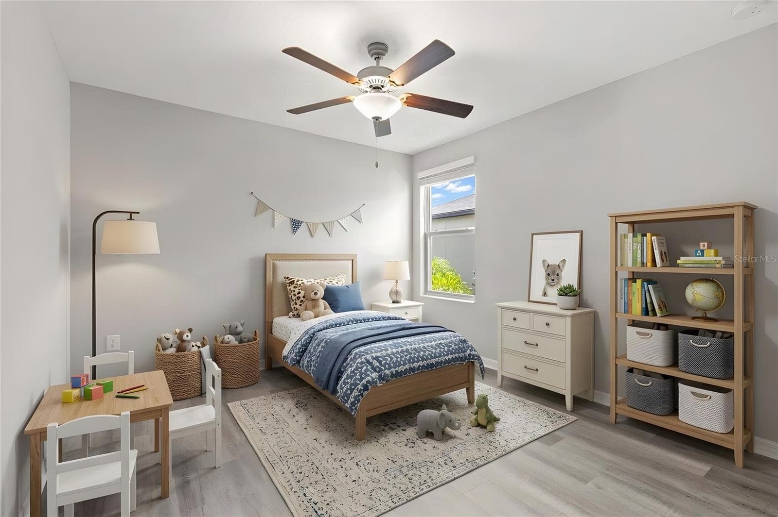 Bedroom 4 offers a comfortable footprint with newly replaced laminate flooring, fresh neutral paint, a ceiling fan and a large window bringing in natural light. - 5061 WHITE CHICORY DR, APOLLO BEACH