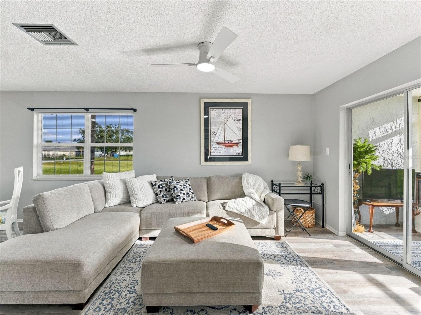 Living Room and Sliding Glass Door to Lanai - 3827 TROPHY BLVD, NEW PORT RICHEY