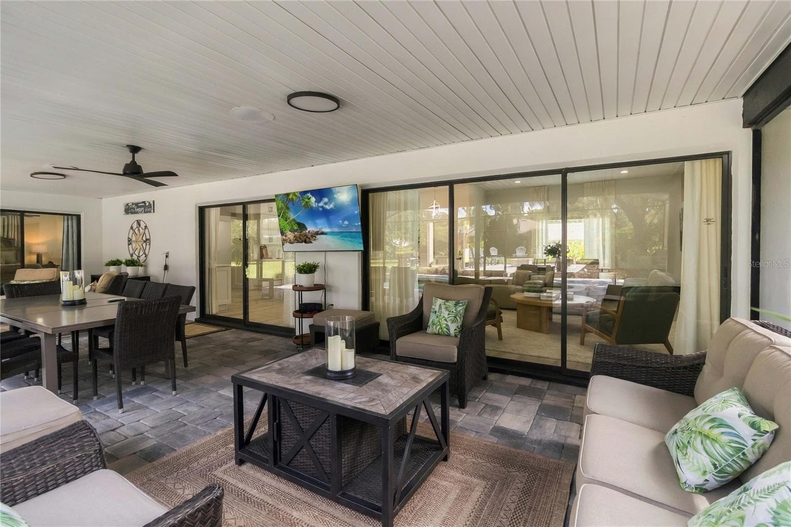 Triple and dual Sliding doors leading to the patio - 3180 WHISPER WIND DR, ST CLOUD