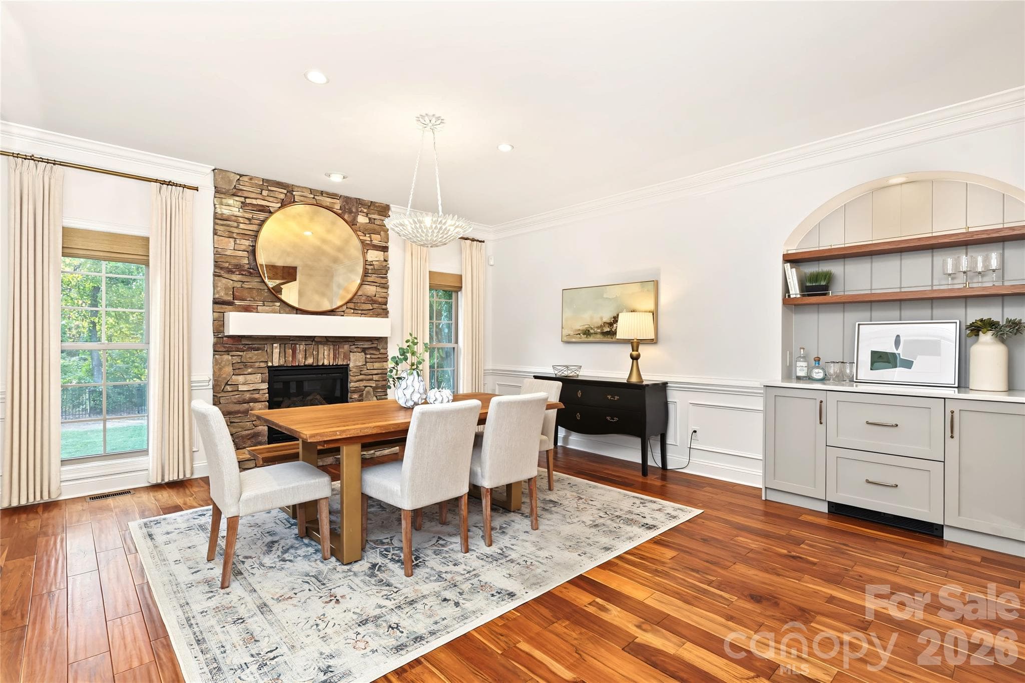 Dining Room with built-ins and a cozy fireplace. - 4934 Spalding Place, Charlotte