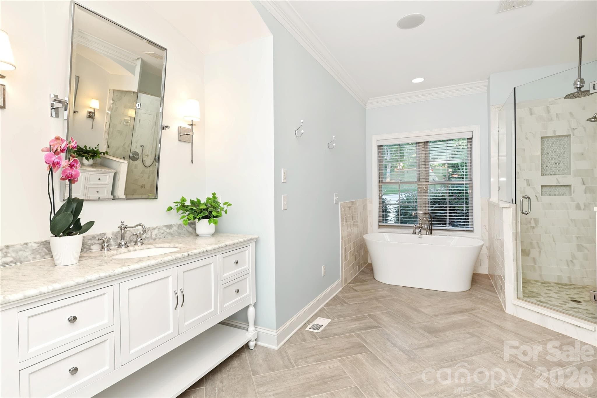 Beautifully renoveated Primary bath with 2 separate vanities and a soaking tub. - 4934 Spalding Place, Charlotte