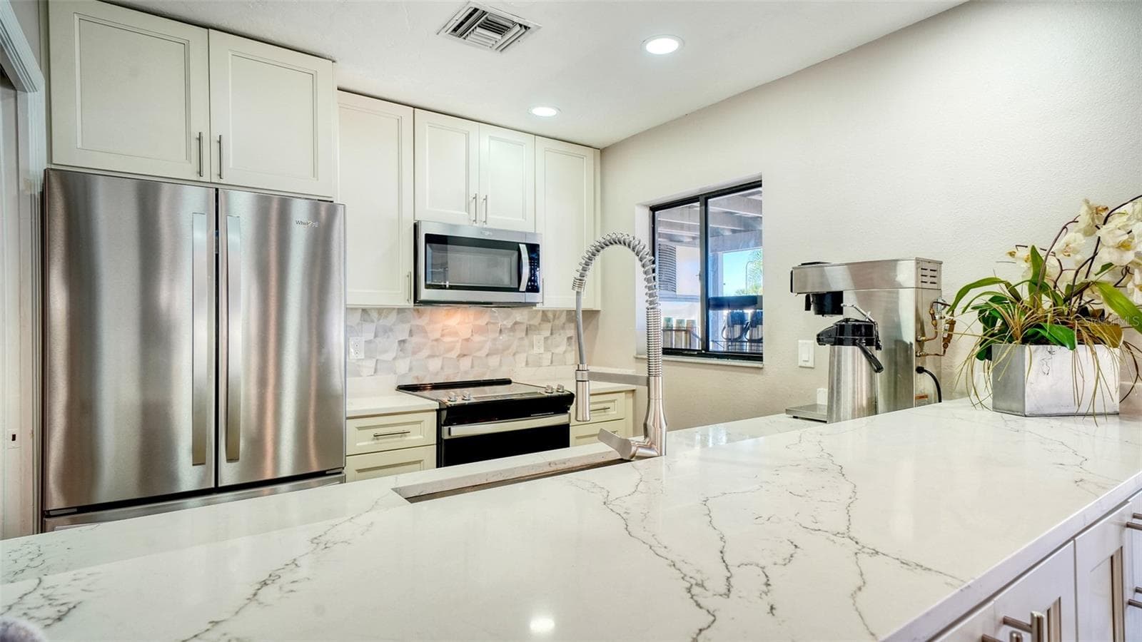 kitchen in club room - 1638 STARLING DR #105, SARASOTA