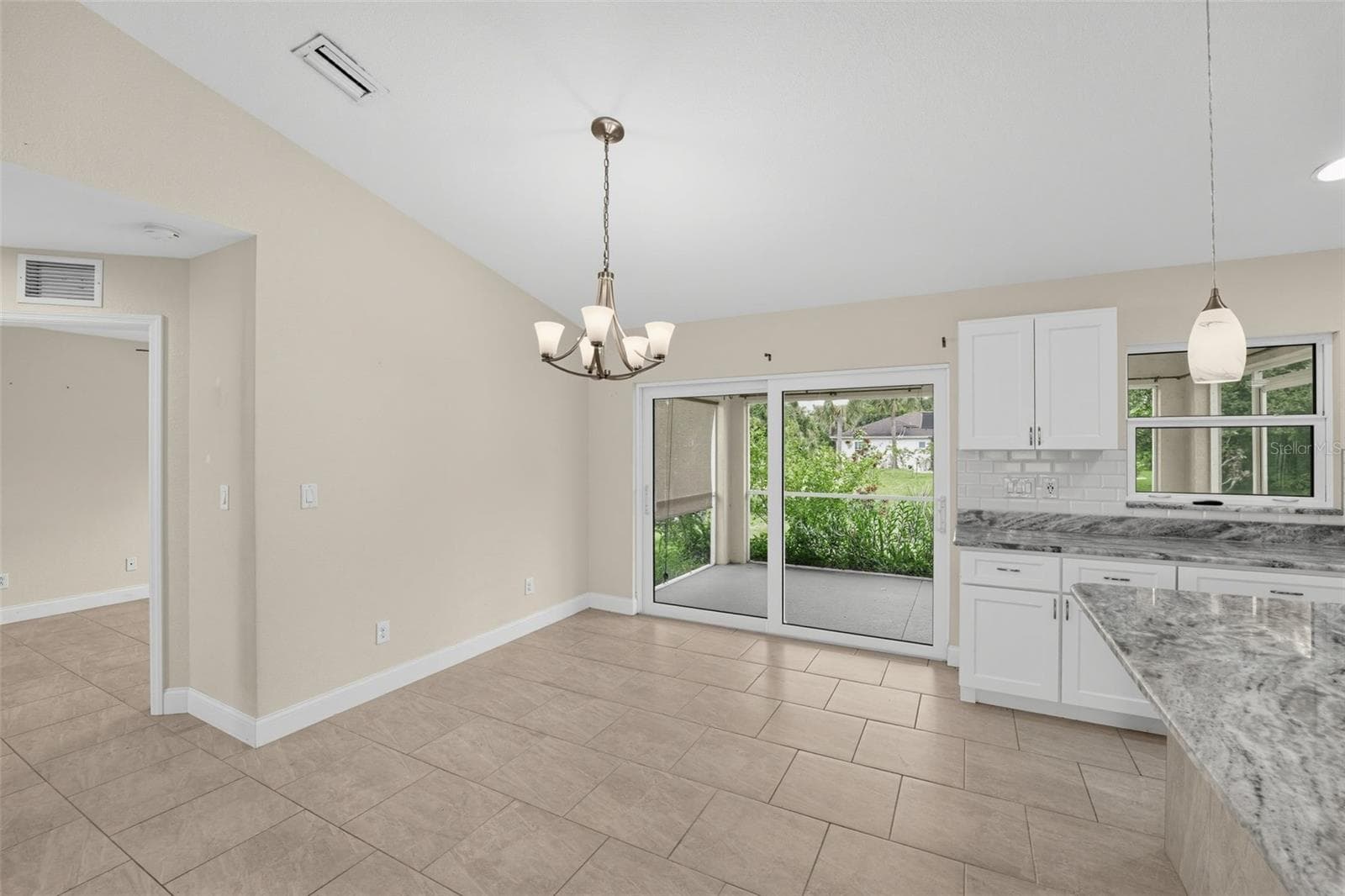 Sliders from the great room to the screened lanai - 2580 VOGLER LN, NORTH PORT
