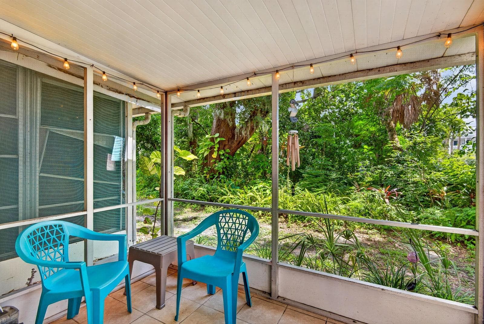 lanai with green behind. - 5853 PALM LN #B7, BRADENTON