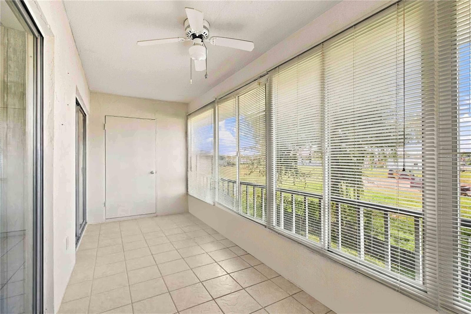 2 separate sliders lead to balcony - 304 47TH AVENUE DR W #313, BRADENTON