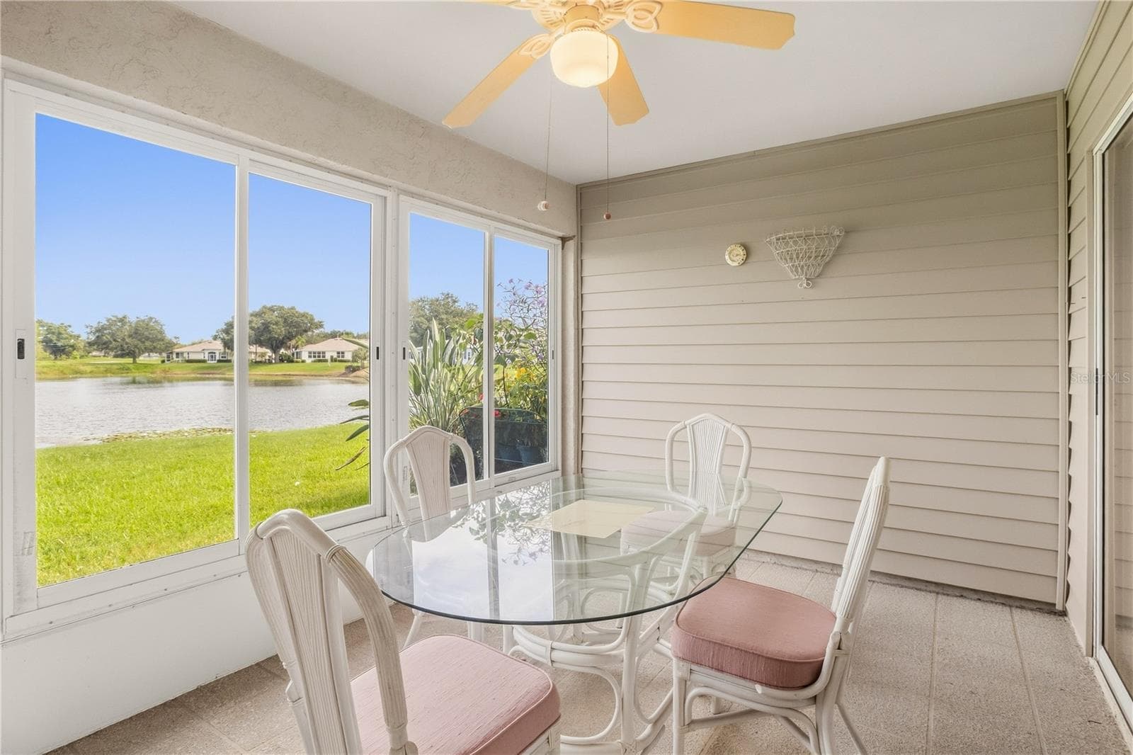 Private enclosed lanai providing a peaceful extension of the living space. - 1002 NICENE CT #47, SUN CITY CENTER