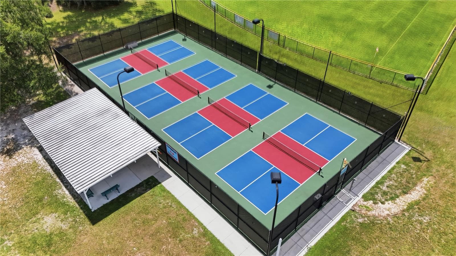 The PICKLEBALL COURTS, where residents enjoy mixed-team play. - 5401 ESSEX CT, LEESBURG