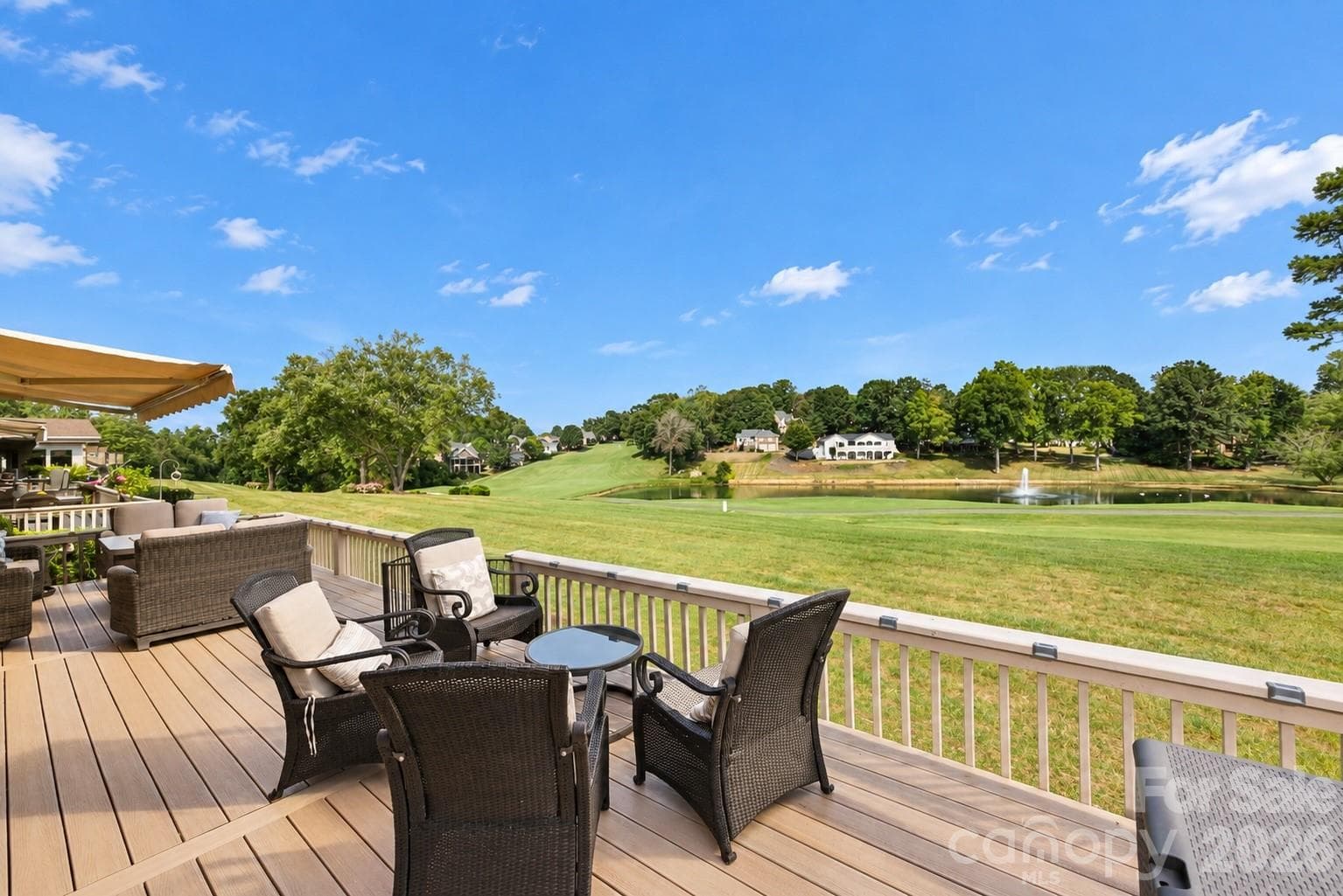 New and enlarged deck overlooking the 10th fairway and pond with fountain. - 3789 Rock Bridge Drive NE, Conover