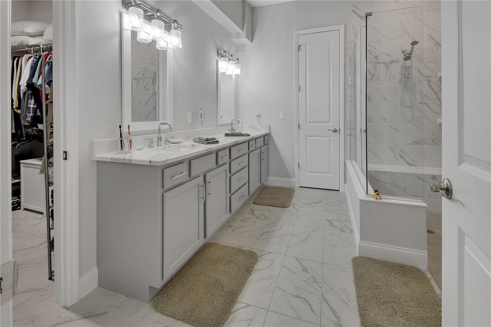 En-suite primary bathroom with linen closet - 1011 MEGANO BLVD, DELAND